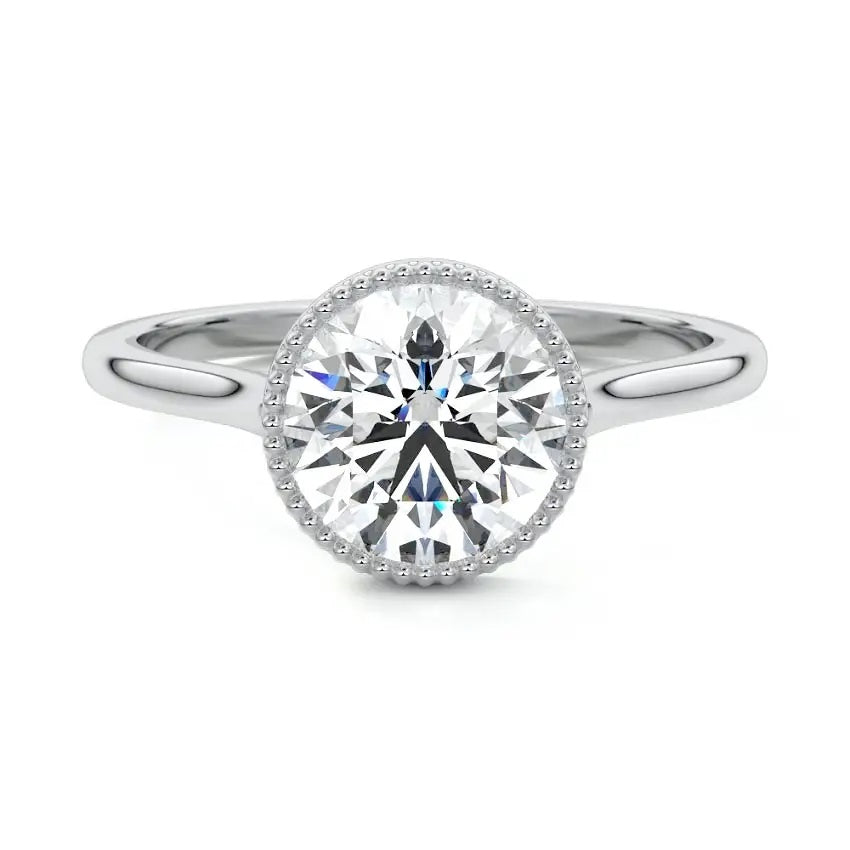 Round cut Moissanite lab grown diamond engagement ring round shank with a bezel setting, on a gold band, against a white background.Moissanite engagement ring cape town south africa grand diamonds ralph jacobs jeulia 