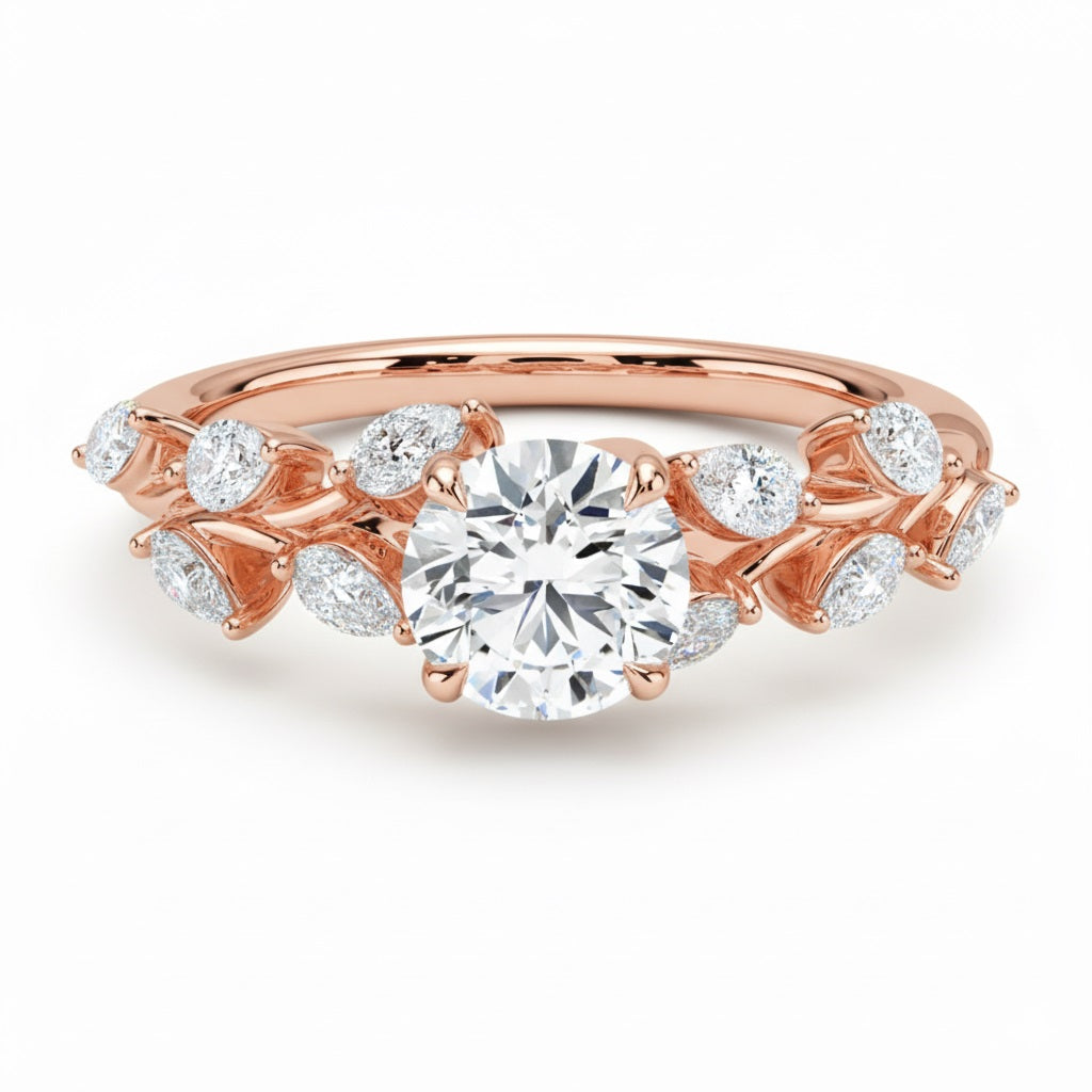 Round cut Moissanite lab grown diamond engagement ring with fancy set small pear moissanite stones on the shank, on a gold band, against a white background.Moissanite engagement ring cape town south africa grand diamonds ralph jacobs jeulia 