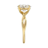Oval cut Moissanite lab grown diamond engagement ring twisted shank with a four cat-claw setting, on a gold band, against a white background.Moissanite engagement ring cape town south africa grand diamonds ralph jacobs jeuli