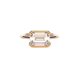 Emerald cut Moissanite lab grown diamond engagement ring column clean sophisticated design on a gold band, against a white background.Moissanite engagement ring cape town south africa grand diamonds ralph jacobs jeuli