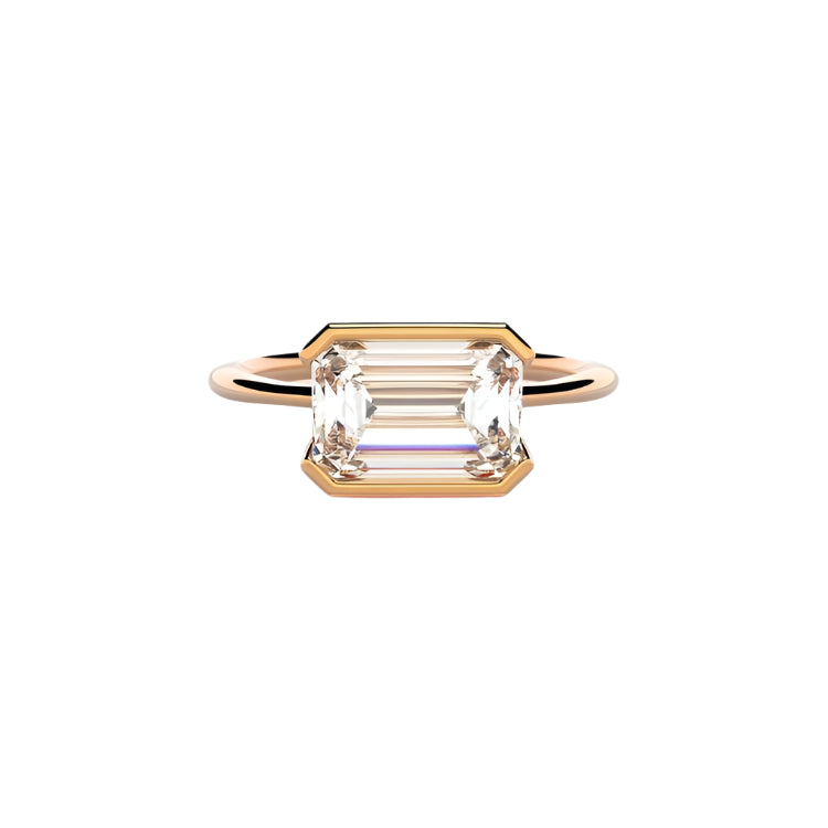 Emerald cut Moissanite lab grown diamond engagement ring column clean sophisticated design on a gold band, against a white background.Moissanite engagement ring cape town south africa grand diamonds ralph jacobs jeuli