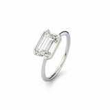 Emerald cut Moissanite lab grown diamond engagement ring column clean sophisticated design on a gold band, against a white background.Moissanite engagement ring cape town south africa grand diamonds ralph jacobs jeuli