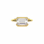Emerald cut Moissanite lab grown diamond engagement ring column clean sophisticated design on a gold band, against a white background.Moissanite engagement ring cape town south africa grand diamonds ralph jacobs jeuli