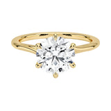 Round cut Moissanite lab grown diamond engagement ring round shank with a six claw setting, on a gold band, against a white background.Moissanite engagement ring cape town south africa grand diamonds ralph jacobs jeulia 