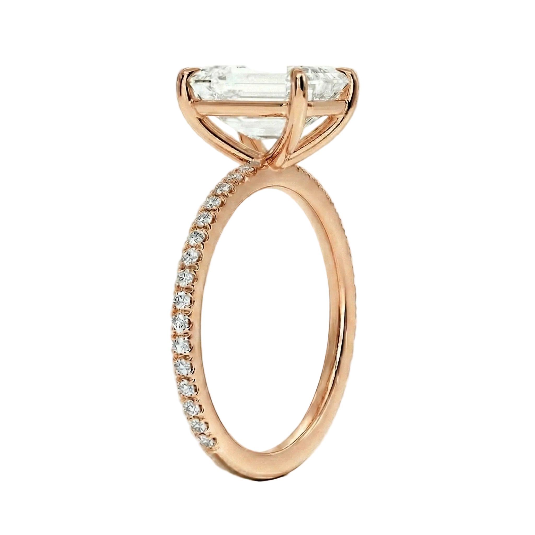 Rose gold ring with a large diamond and smaller diamonds on the band against a white background