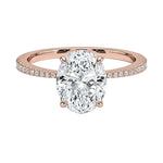 Sculpted four-claw oval cut engagement ring with a tapered pavé rose gold band ApolloGem.