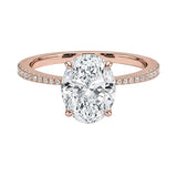 Sculpted four-claw oval cut engagement ring with a tapered pavé rose gold band ApolloGem.