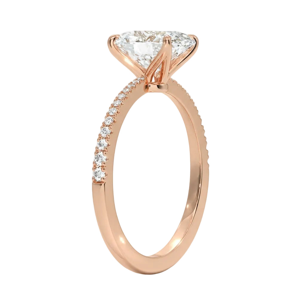 Oval cut Moissanite lab grown diamond engagement ring with tapered pave set shank on a gold band, against a white background.Moissanite engagement ring cape town south africa grand diamonds ralph jacobs jeulia 