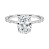 Sculpted four-claw oval cut engagement ring with a tapered pavé white gold band ApolloGem.