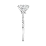 Top-down view of a D-color VVS1 oval stone in a polished white gold tapering pavé setting.