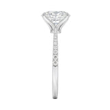 Top-down view of a D-color VVS1 oval stone in a polished white gold tapering pavé setting.