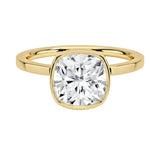 Cushion cut Moissanite engagement ring with a bezel setting, displayed on a gold band, against a white background.Moissanite engagement ring cape town south africa grand diamonds ralph jacobs jeulia "