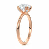 Engagement ring round cut Moissanite lab grown diamond engagement ring round shank with four  double cat law setting, on a gold band, against a white background.Moissanite engagement ring cape town south africa grand diamonds ralph jacobs jeulia 