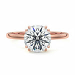 Engagement ring round cut Moissanite lab grown diamond engagement ring round shank with four  double cat law setting, on a gold band, against a white background.Moissanite engagement ring cape town south africa grand diamonds ralph jacobs jeulia 