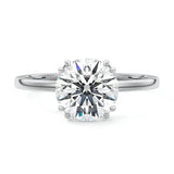 Engagement ring round cut Moissanite lab grown diamond engagement ring round shank with four  double cat law setting, on a gold band, against a white background.Moissanite engagement ring cape town south africa grand diamonds ralph jacobs jeulia 