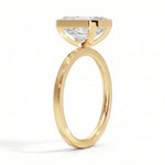 Flat band engagement ring bezel set emerald cut yellow gold modern style South Africa