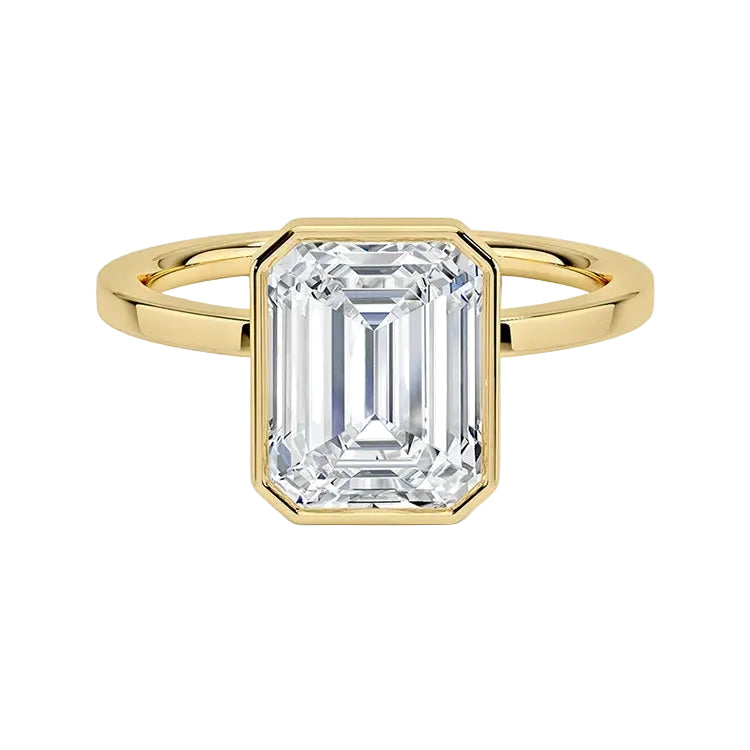Emarald cut Moissanite engagement ring with a bezel setting, displayed on a gold band, against a white background.Moissanite engagement ring cape town south africa grand diamonds ralph jacobs jeulia "