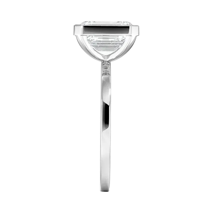 An Emarald cut Moissanite engagement ring with a bezel setting, displayed on a gold band, against a white background.Moissanite engagement ring cape town south africa grand diamonds ralph jacobs jeulia "