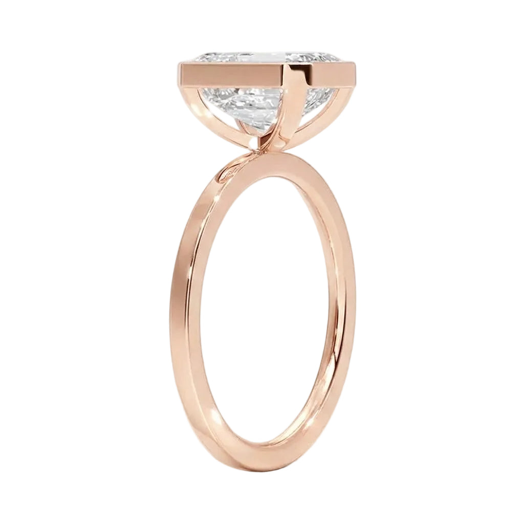 Top-down view of a D-color VVS1 emerald brilliance moissanite in a rose gold solitaire setting.