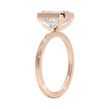 Top-down view of a D-color VVS1 emerald brilliance moissanite in a rose gold solitaire setting.