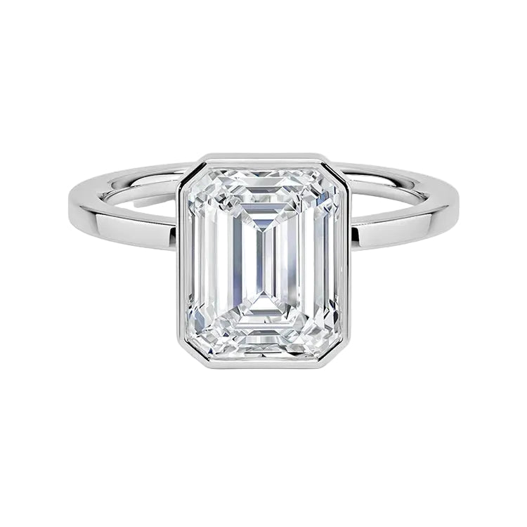 Modern bezel set emerald cut moissanite solitaire ring with a flat gold band ApolloGem