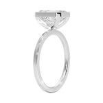 Step cut emerald stone VVS clarity gold rim setting flat band close up