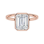 Square edge gold band ring with bezel setting emerald moissanite side view