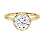 The Architectural Round moissanite solitaire ring with a flat yellow gold band ApolloGem
