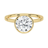 The Architectural Round moissanite solitaire ring with a flat yellow gold band ApolloGem