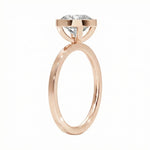 Top-down view of a D-color VVS1 round stone in a polished rose gold bezel setting