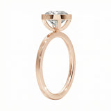 Top-down view of a D-color VVS1 round stone in a polished rose gold bezel setting