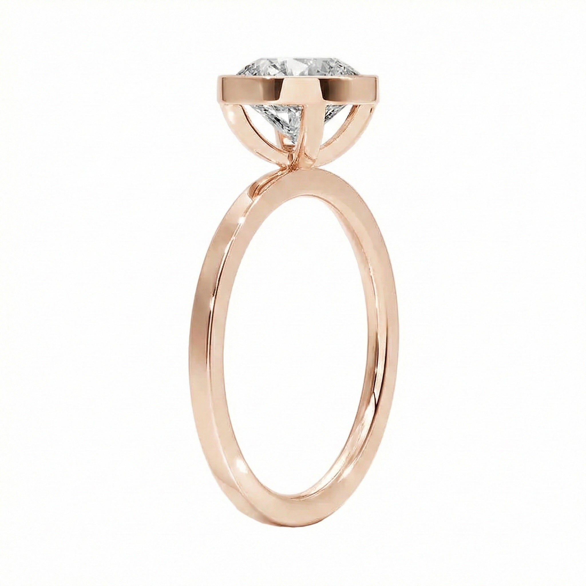 Top-down view of a D-color VVS1 round stone in a polished rose gold bezel setting