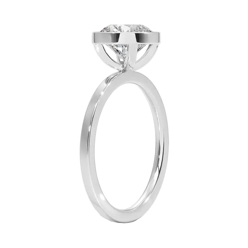 Top-down view of a D-color VVS1 round stone in a polished white gold bezel setting