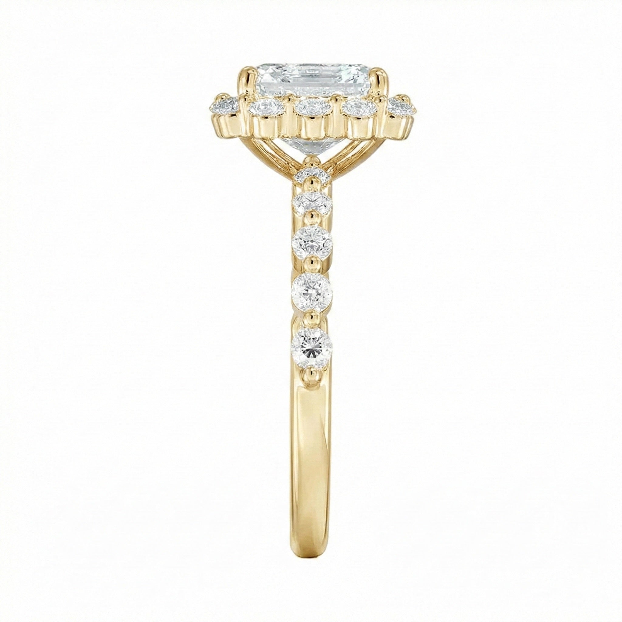 Gold ring with a diamond on a white background