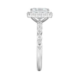 Diamond ring with a central gemstone and smaller stones on a white background