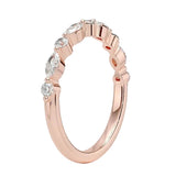 Rose gold ring with diamonds on a white background