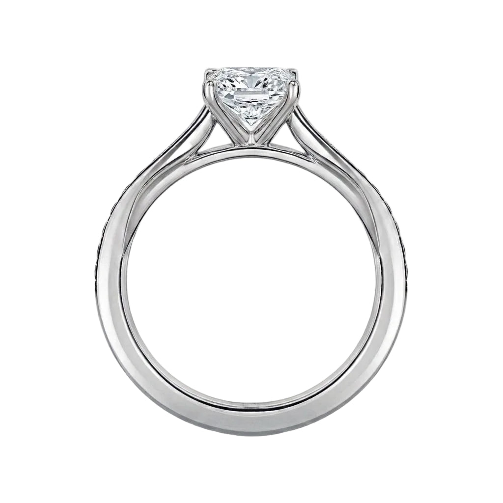 Diamond ring with a heart-shaped center stone on a white background