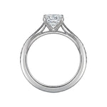 Diamond ring with a heart-shaped center stone on a white background