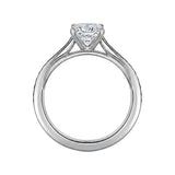 Diamond ring with a heart-shaped center stone on a white background