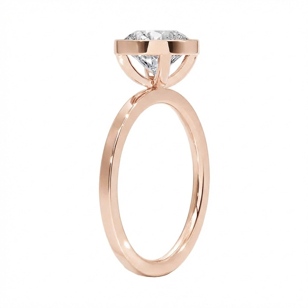 Side view of The Cushion Bezel ring showing the secure gold setting and flat-edge band