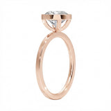 Side view of The Cushion Bezel ring showing the secure gold setting and flat-edge band