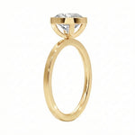 Side view of The Cushion Bezel ring showing the secure gold setting and flat-edge band