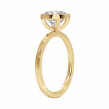 Side view of The Cushion Bezel ring showing the secure gold setting and flat-edge band