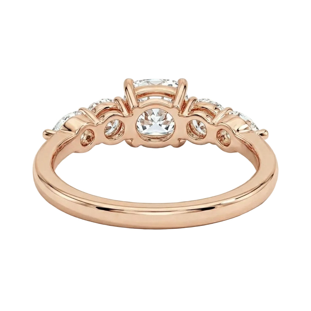 Rose gold ring with diamonds on a white background