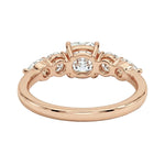 Rose gold ring with diamonds on a white background