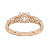 Rose gold ring with diamonds on a white background