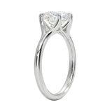 Detailed side view of the Cushion Zenith Aeris ring showing the arched cathedral setting and split-shoulder design.
