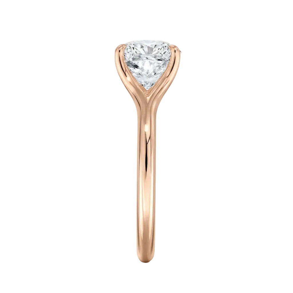 Close-up of a high-quality D-color VVS1 cushion moissanite in an elegant architectural gold setting.