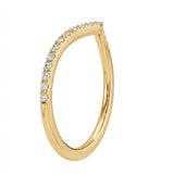 Close-up of a chevron wedding ring in yellow gold with micro-pavé set moissanite stones.