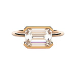 Emerald cut moissanite solitaire engagement ring in a modern East-West column setting ApolloGem.